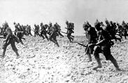 photo of WWII soldiers walking on beach