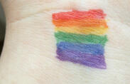 Picture of pride flag on wrist.