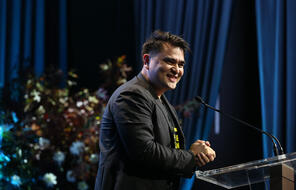 Jose Antonio Vargas smiling at a podium