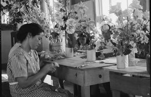 Manzanar Relocation Center, Manzanar, California. Making artificial flowers in the Art School at this War Relocation Authority center for evacuees of Japanese ancestry.