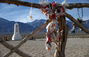 A white moument with brown symbols in the cemetery at Manzanar National Historic Site