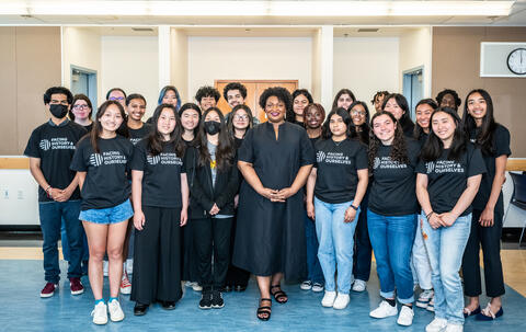 Stacey Abrams poses for a photo with Facing History students.