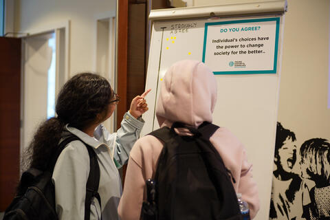 Two students interact with a posed question.