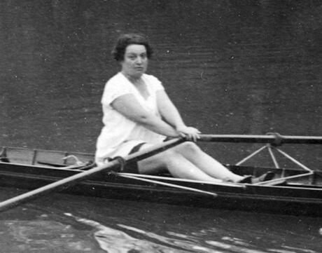 Black and white image of French Athlete Alice Milliat in rowboat.