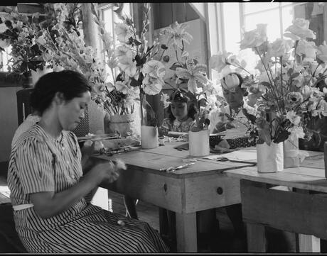 Manzanar Relocation Center, Manzanar, California. Making artificial flowers in the Art School at this War Relocation Authority center for evacuees of Japanese ancestry.