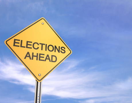 Elections Ahead on a Caution Sign with a Blue Sky Behind